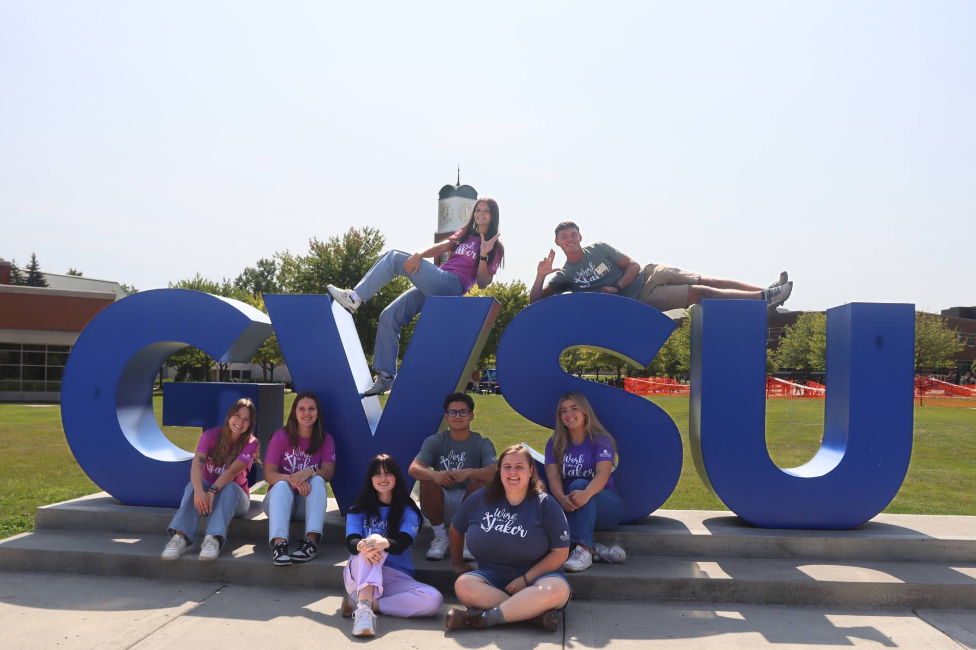 students on gvsu sign